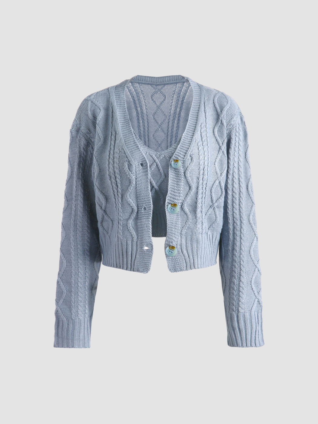 Blaues Zopfmuster-Tanktop und Strickjacke