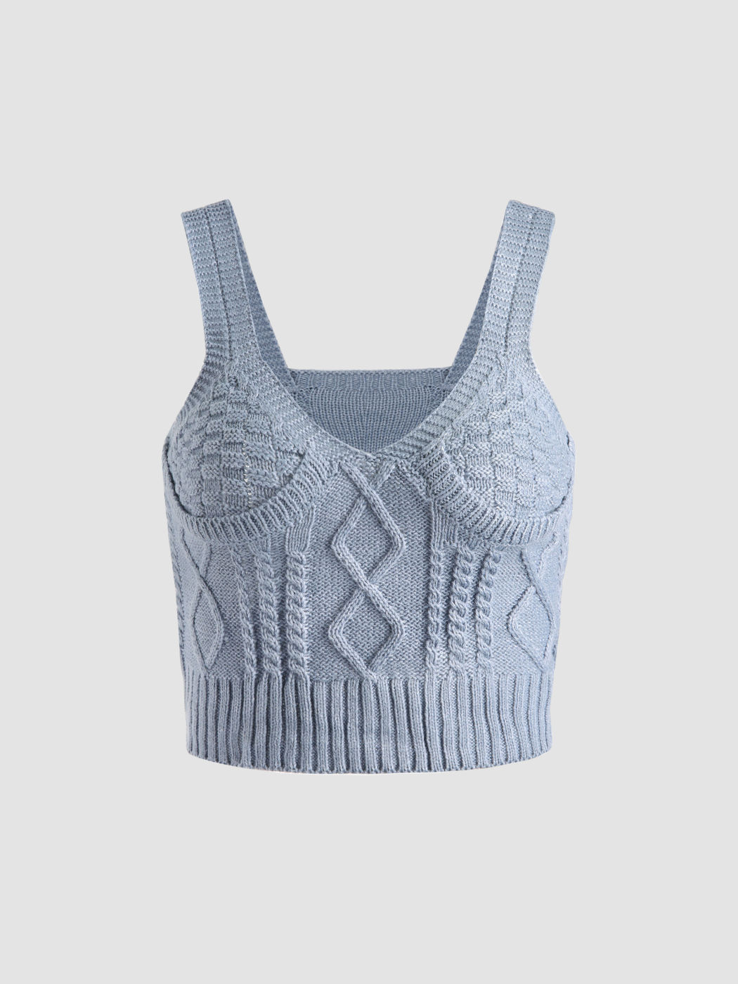 Blaues Zopfmuster-Tanktop und Strickjacke
