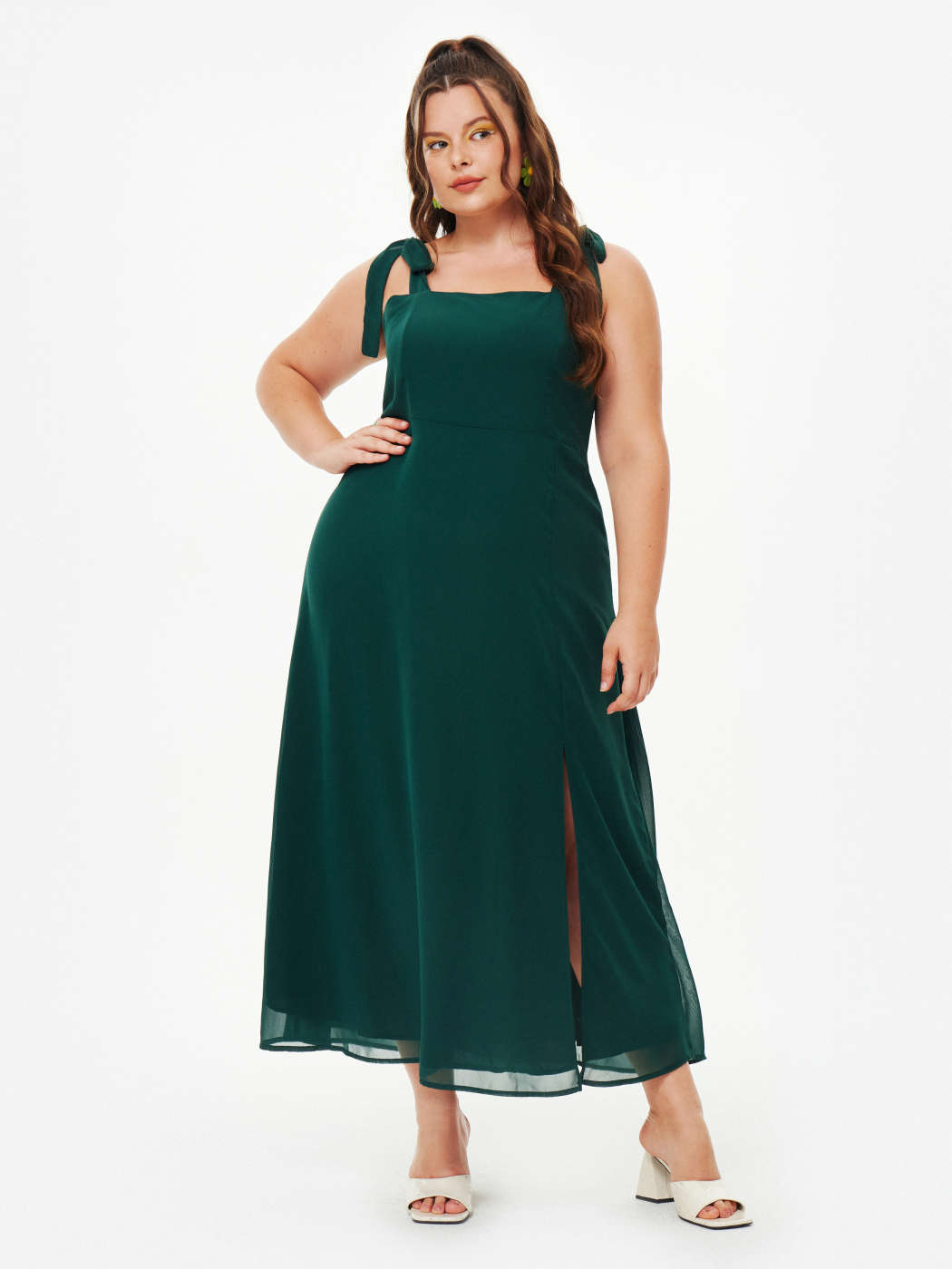 A woman in a plus size Slit Cider Dress