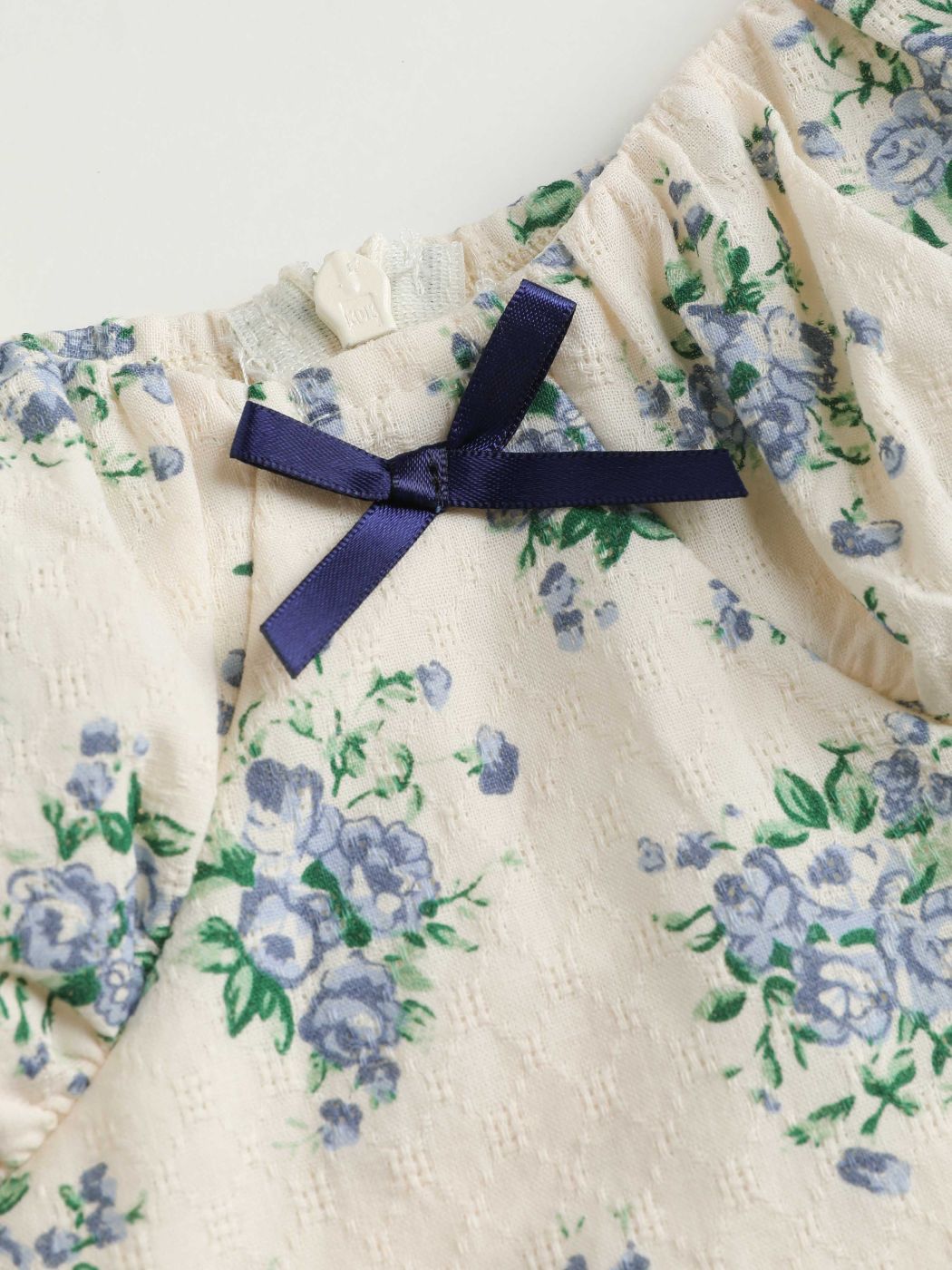 Jacquard-Minikleid mit floraler Schleife