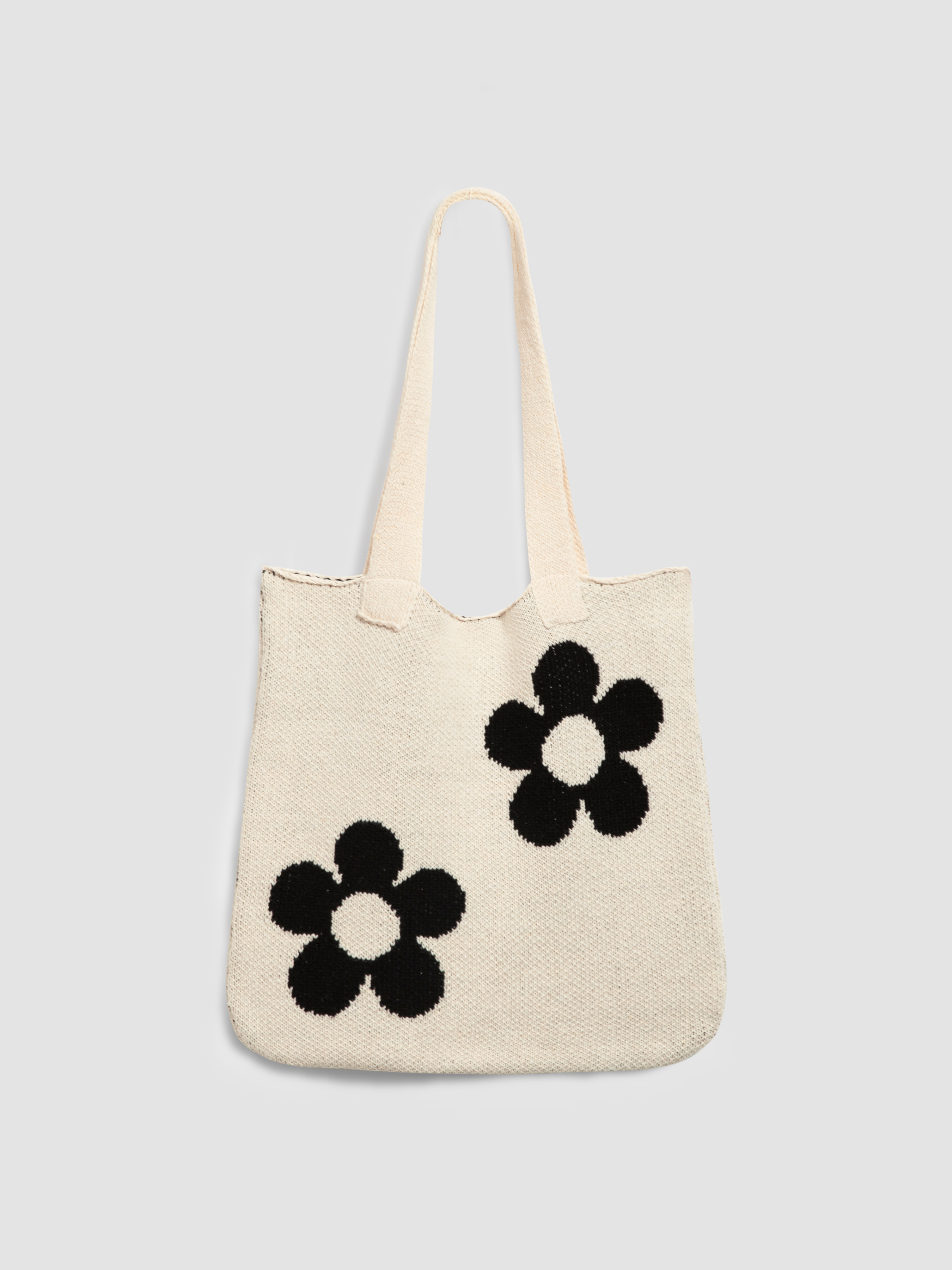 White fuzzy bag 2024 with black flowers