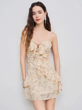 Abito corsetto con laccetti e finiture con volant