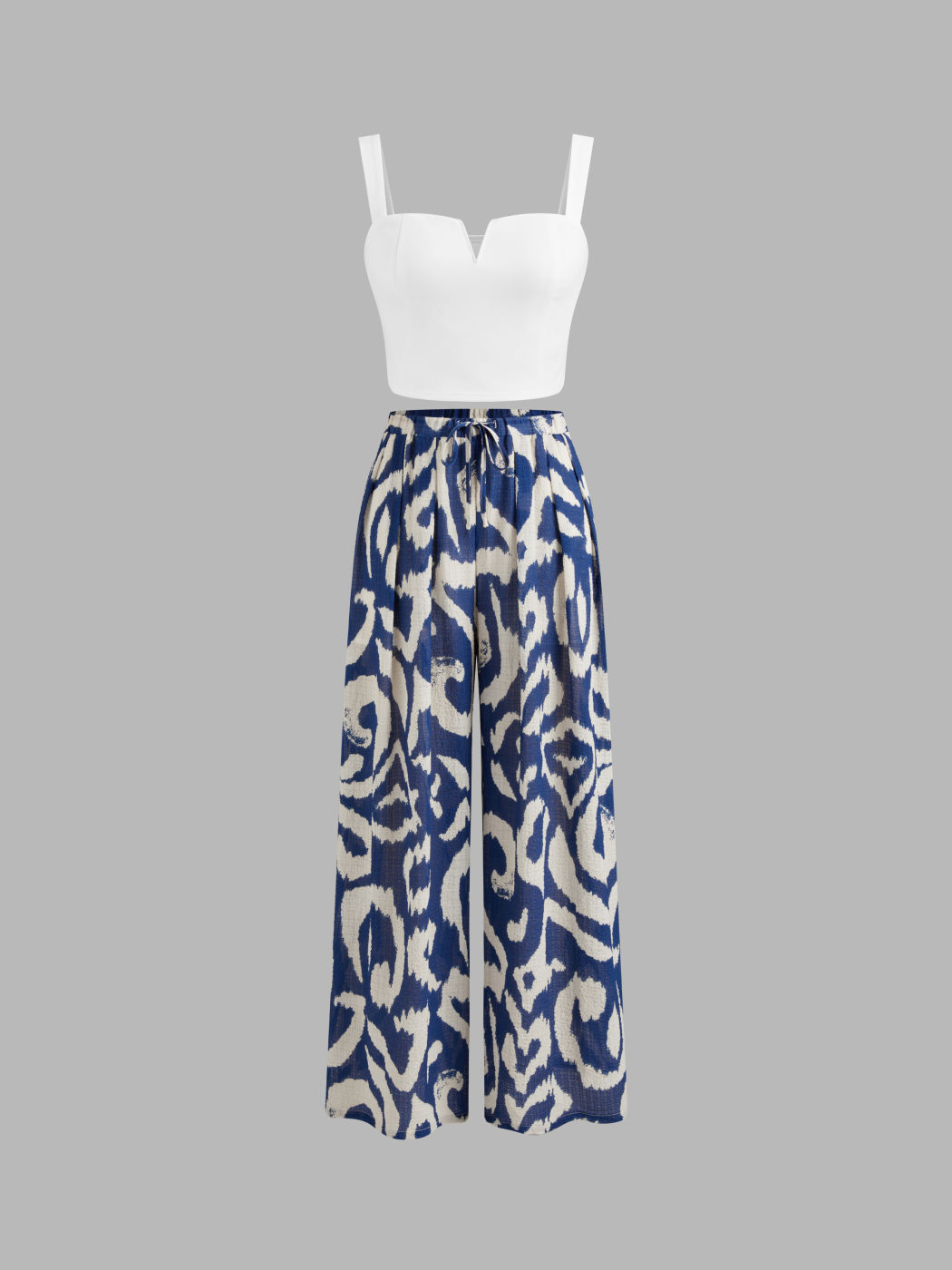 Quadratischer Hals, einfarbiges Crop-Tank-Top mit hoch angesetzten, abstrakt geknoteten Breitbein-Hosen