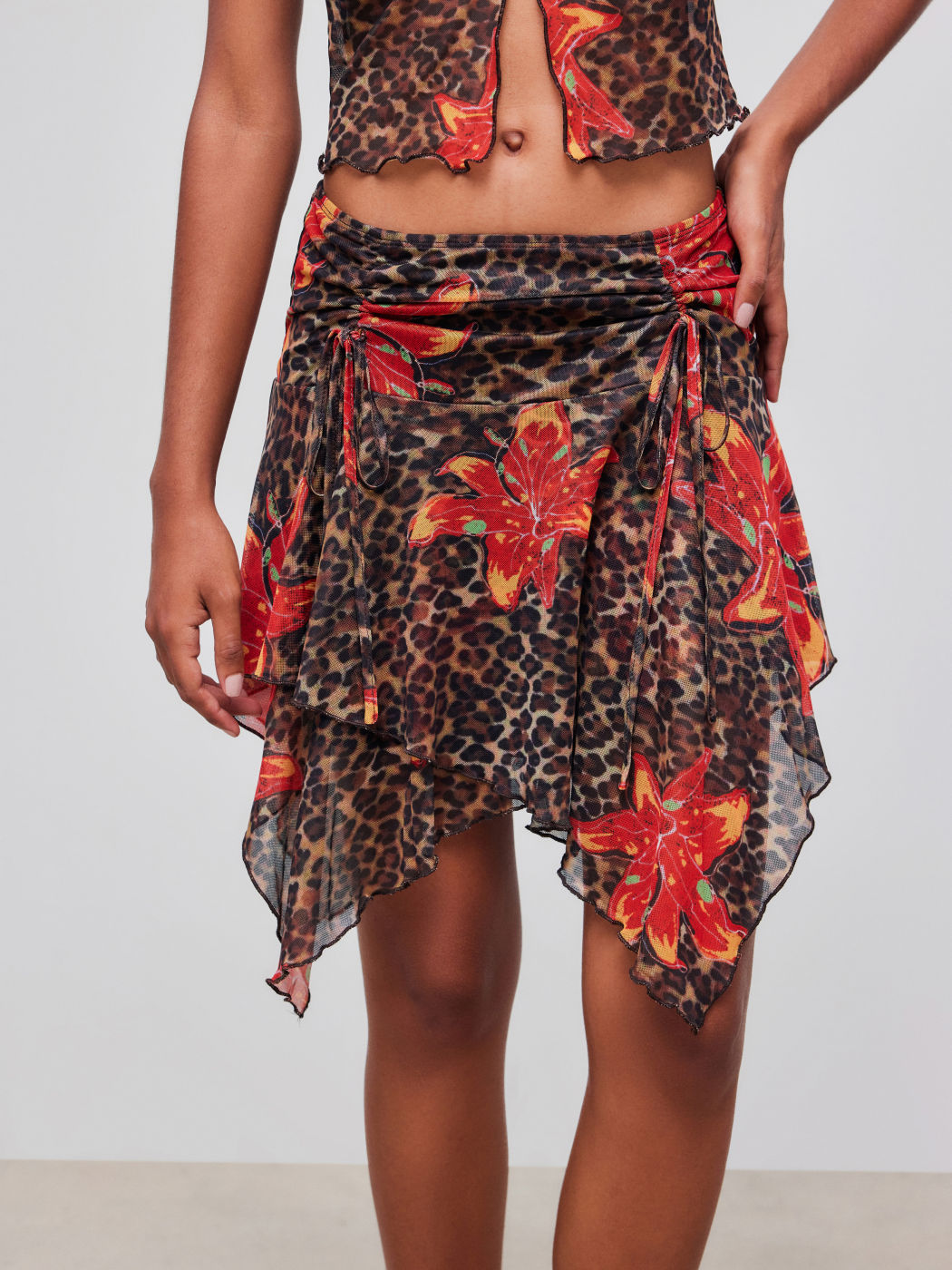 Mid Rise Leopard Floral Drawstring Asymmetric Hem Mini Skirt