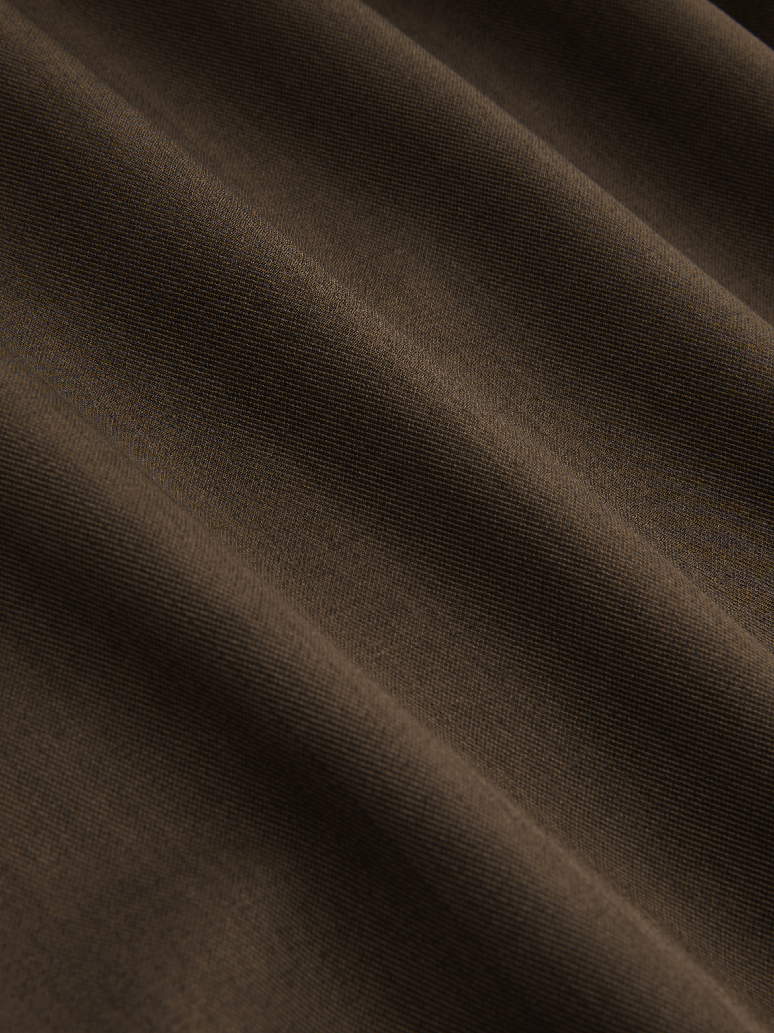 Tief sitzende einfarbige Hose mit Spitzenrand und Taschen, Breitbein