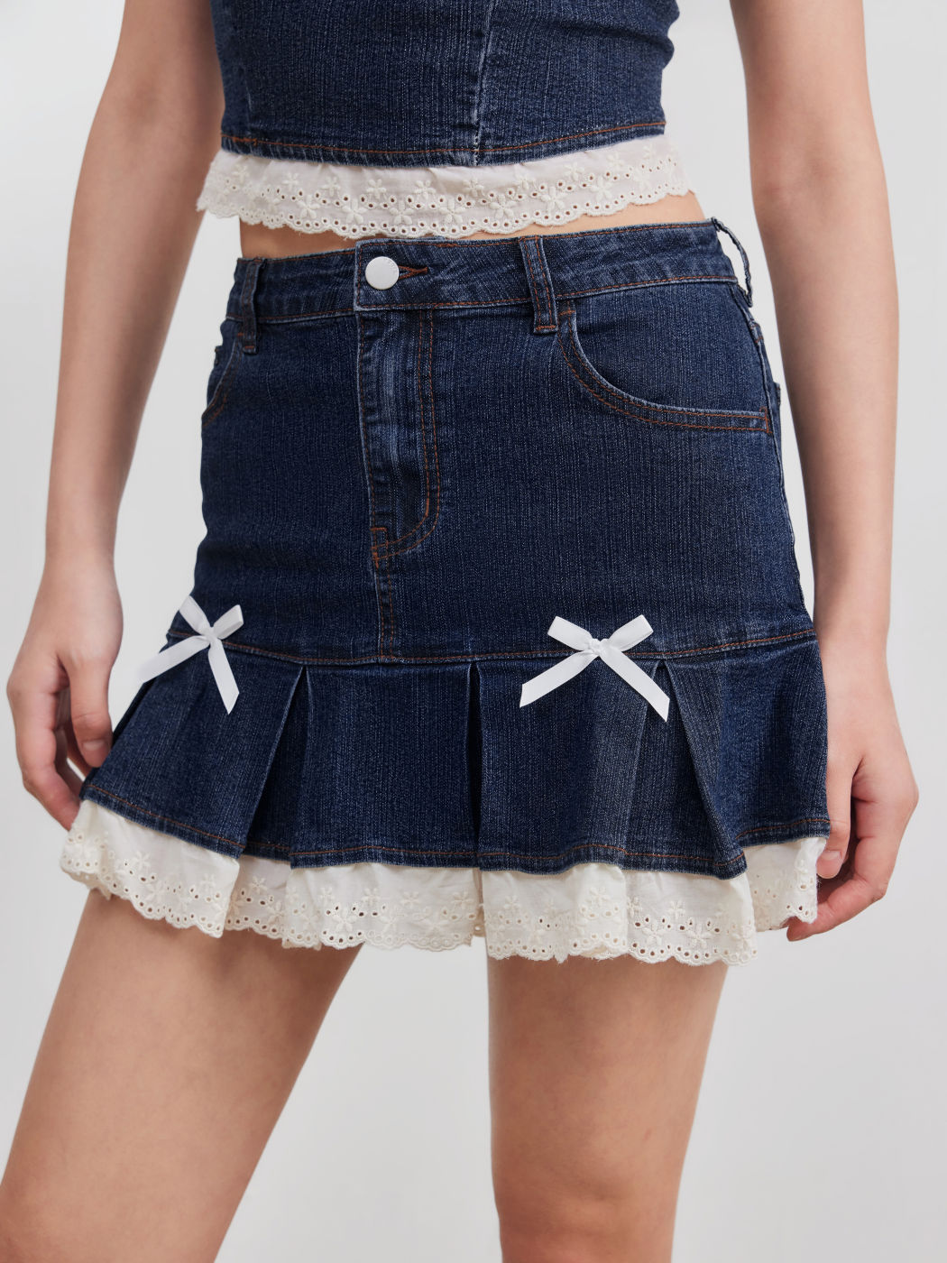 High Stretch Denim Mid Rise Broderie Anglaise Hem Bowknot Mini Skirt