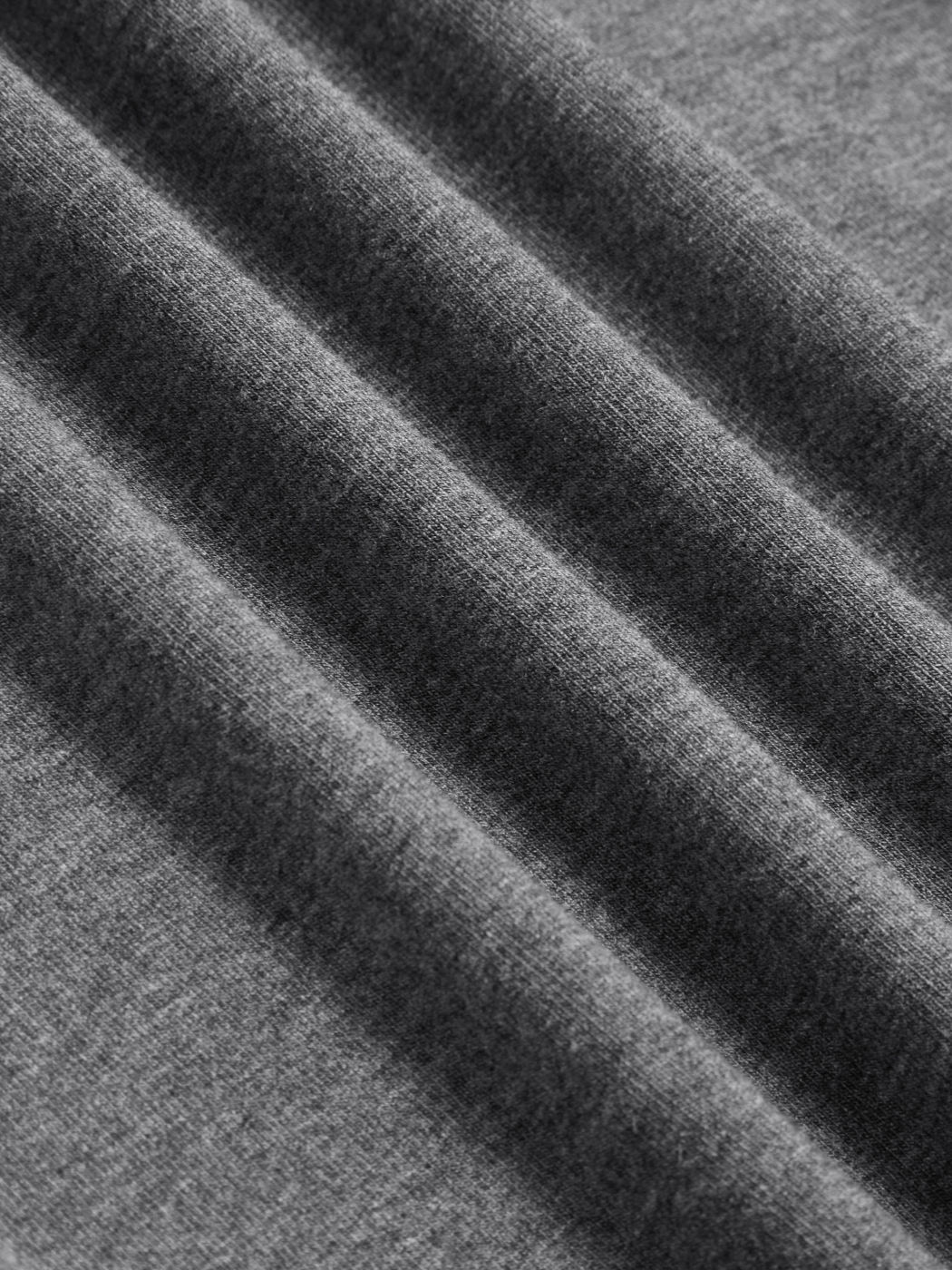 Top a manica lunga con scollo rotondo e bordatura in pizzo a contrasto