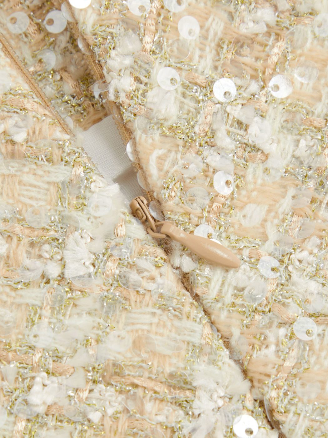 Minigonna tweed con paillettes a vita alta e tinta unita