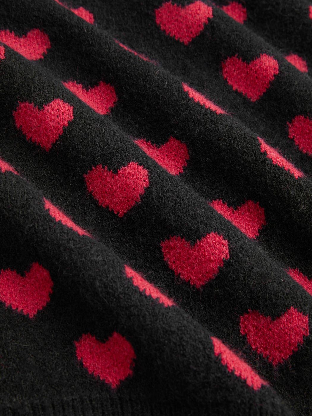 Cárdigan de punto con gráfico de corazón y cuello en V