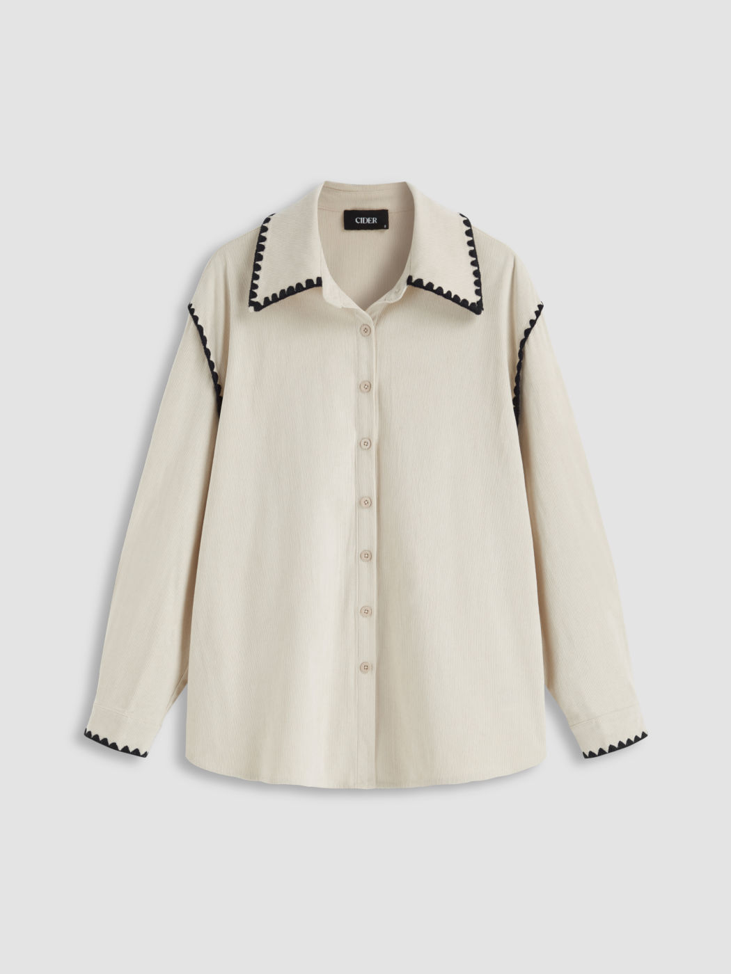 Camicetta oversize con colletto in velluto a coste e rilegatura a contrasto