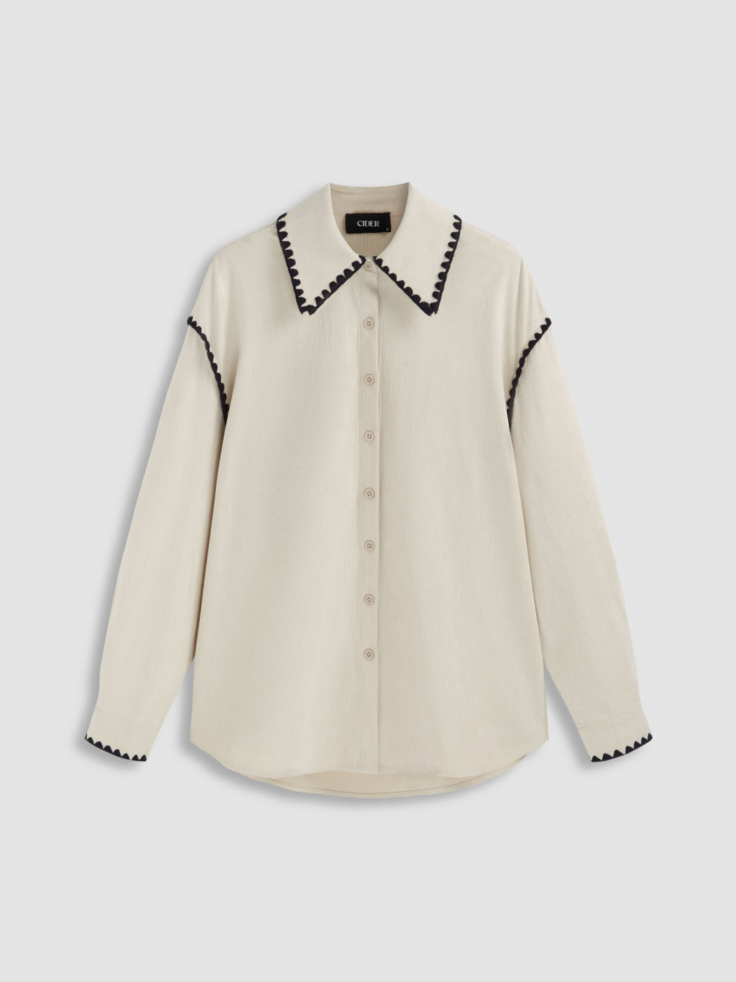 Camicetta oversize con colletto in velluto a coste e rilegatura a contrasto