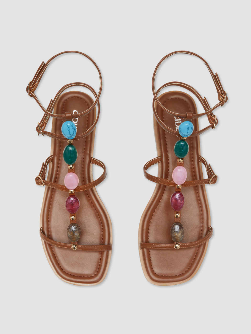Farbenfrohe Steinknopf-Romansandalen