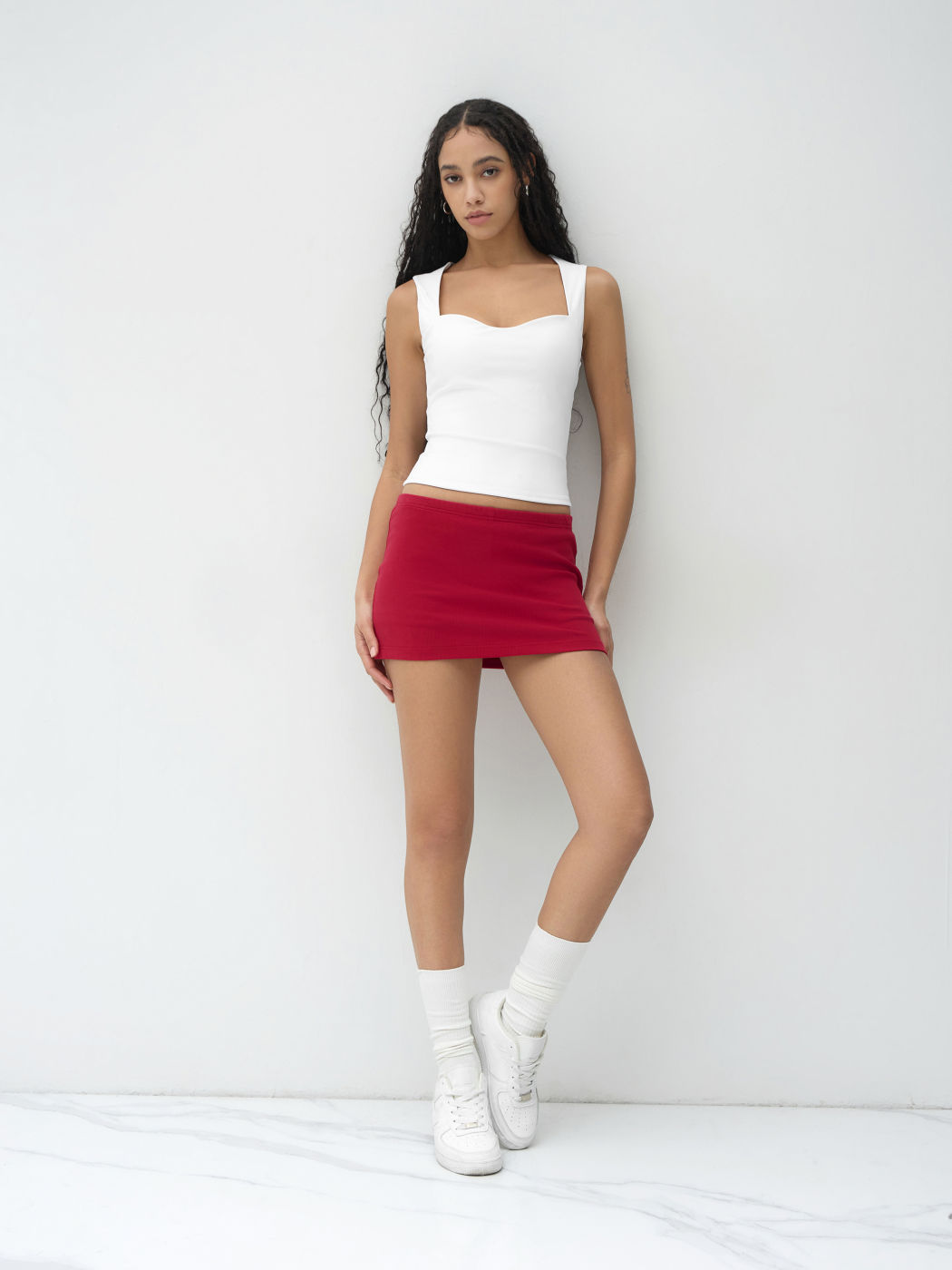 Mini gonna-pantalone a vita bassa in misto cotone elasticizzato con spacchi