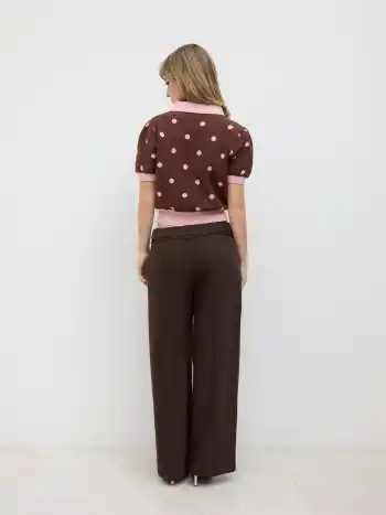 Top in maglia con colletto Peter Pan e maniche a sbuffo a pois