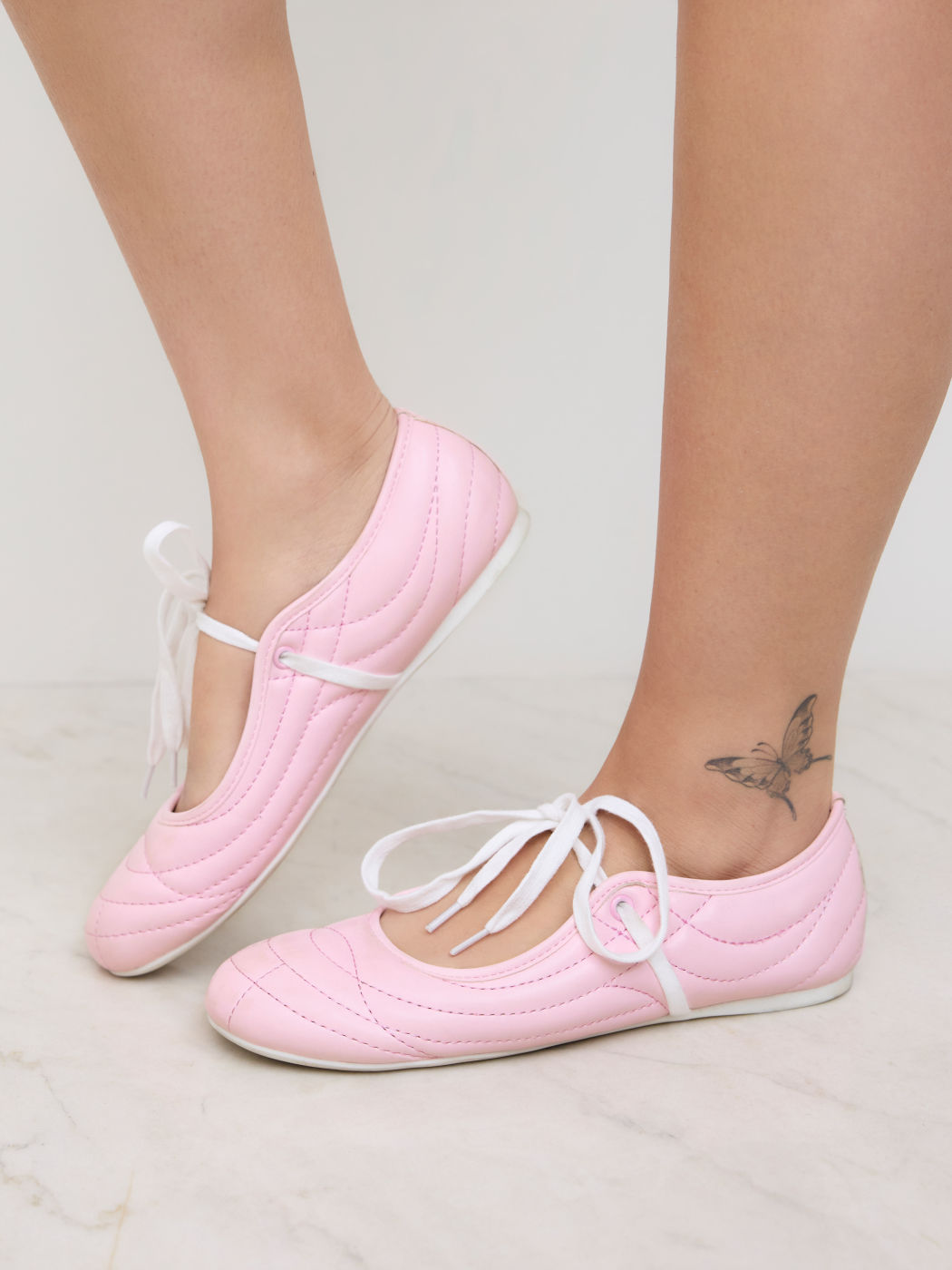 SEAM-DETAILED LACE-UP FAUX LEATHER SNEAKERS