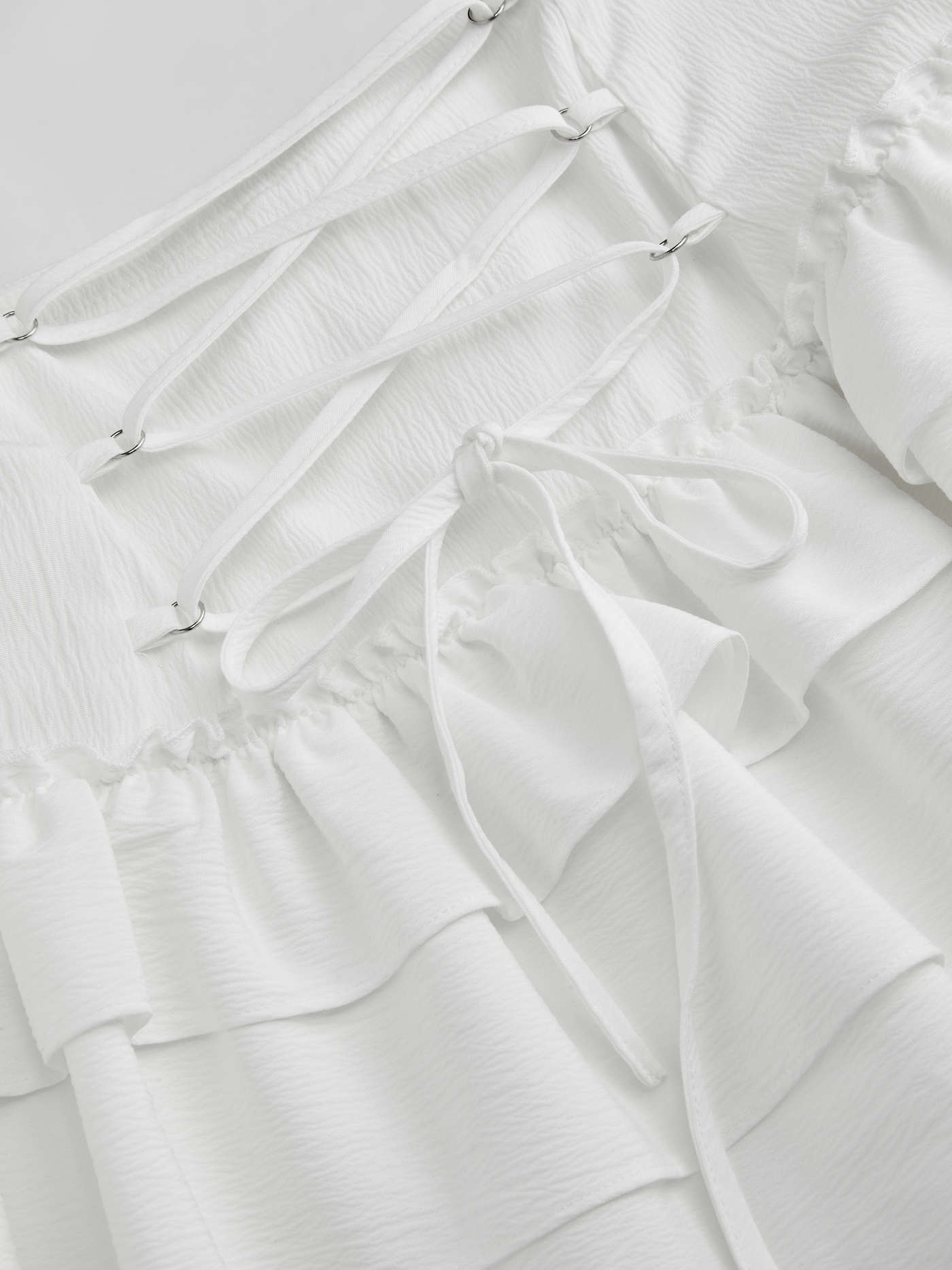 Mid Rise Lace Up Ruffle Hem Layered Mini Skirt