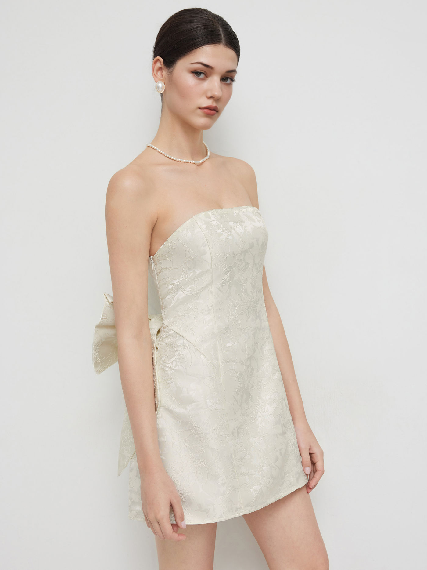 Mini abito con fiocco in tubo jacquard
