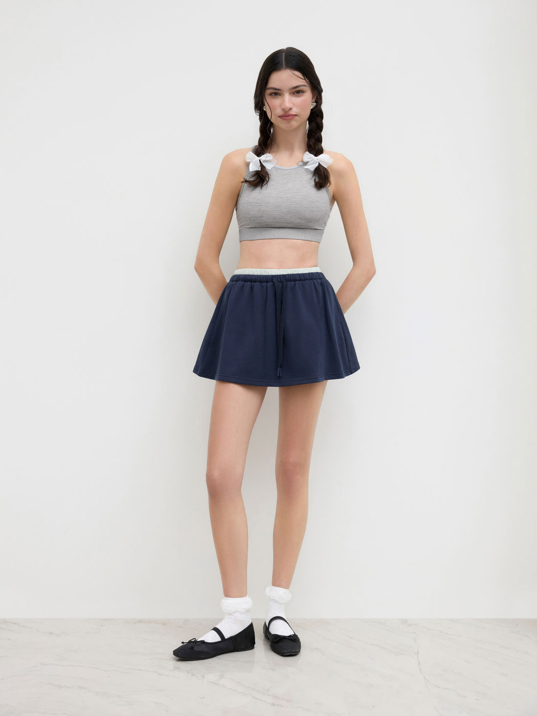 Mini gonna-pantalone a vita media in misto cotone con fiocco annodato sul davanti