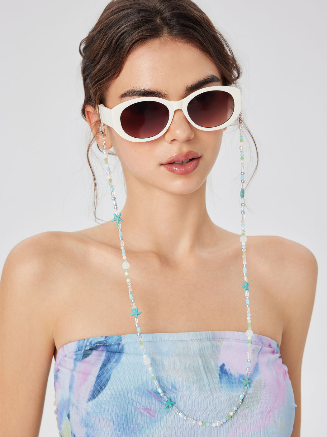 CATENE PER OCCHIALI CON STELLA MARINA, PERLA SIMULATA E PERLINE COLORATE