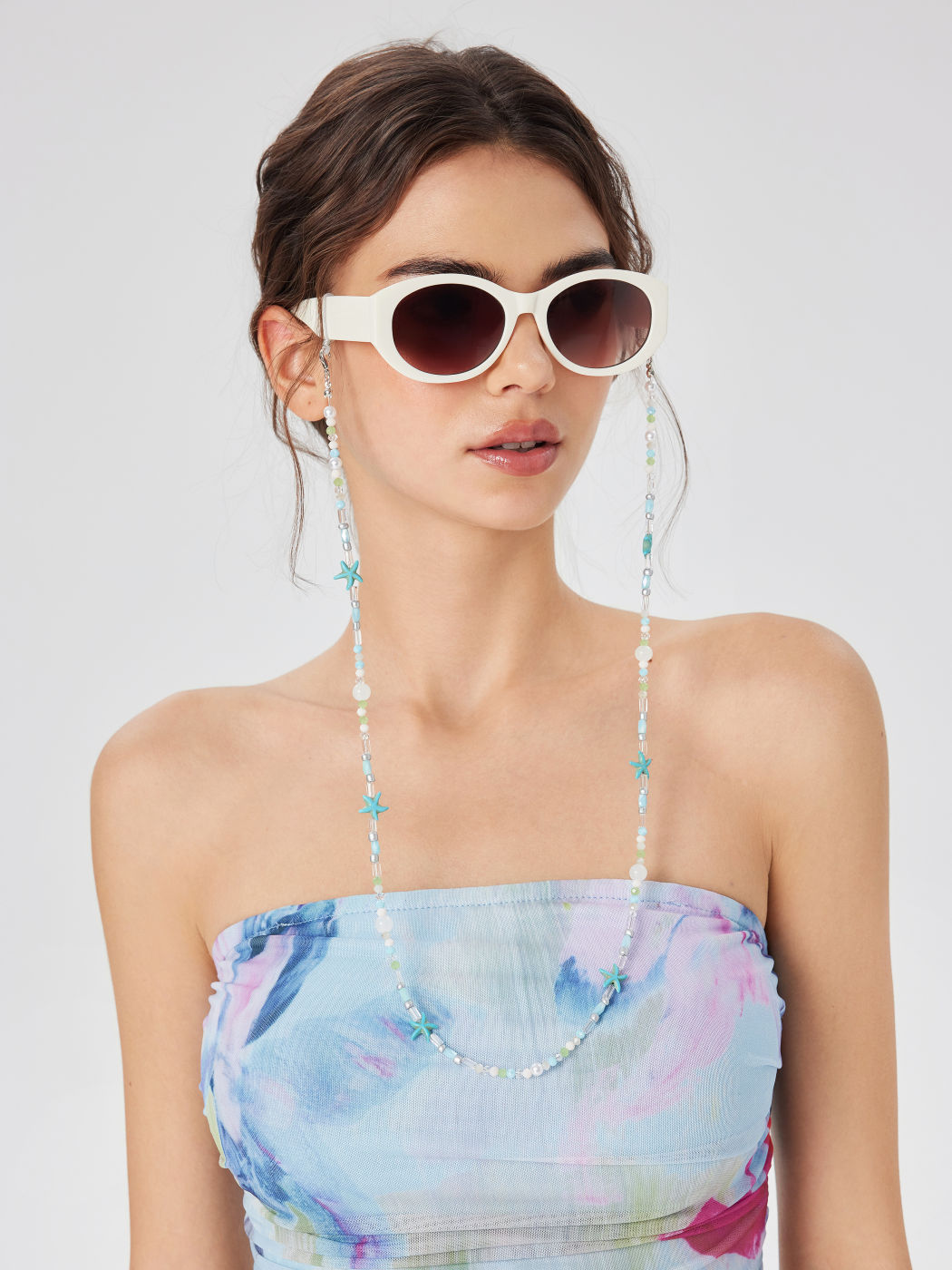 CATENE PER OCCHIALI CON STELLA MARINA, PERLA SIMULATA E PERLINE COLORATE