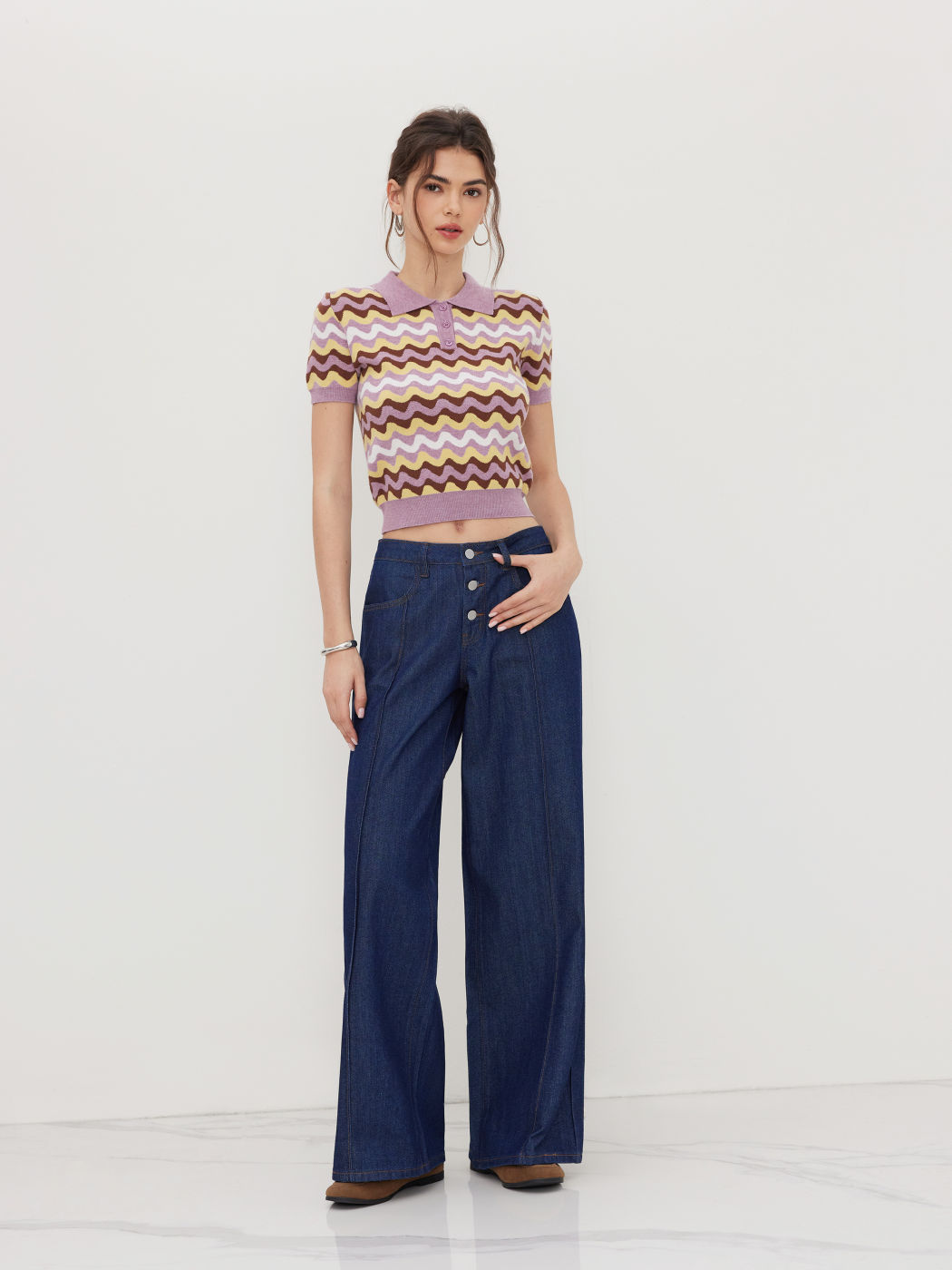 Polo in maglia a righe ondulate a maniche corte