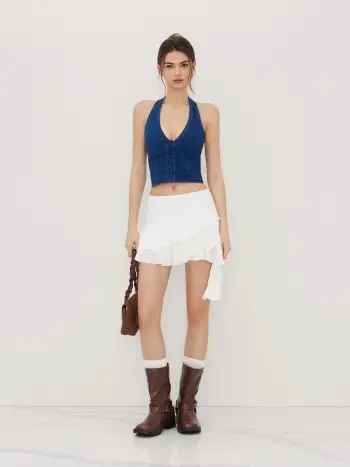 Top corto con scollo all'americana a V in denim elasticizzato con bottoni