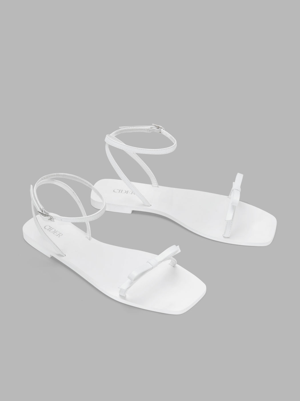 BOW & ADJUSTABLE STRAP FAUX LEATHER FLAT SANDALS