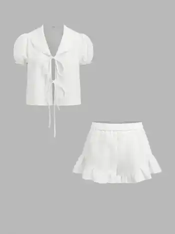 Set loungewear con top a maniche a sbuffo con scollo a V e nodo sul davanti in misto lino e shorts a vita media con orlo a volant