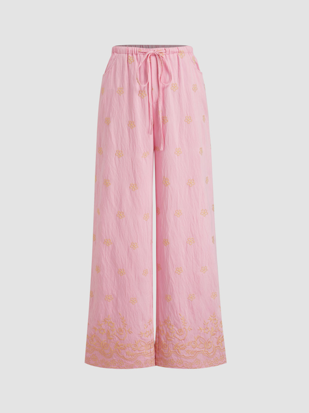 Tief sitzende, floral bestickte, geradbeinige Hosen