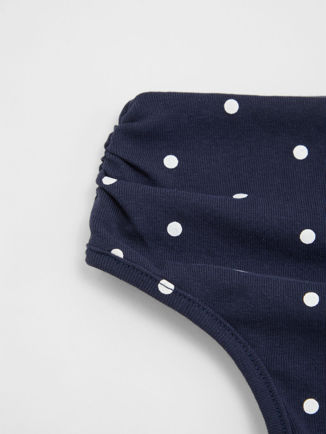 Cotton-blend Asymmetrical Neck Polka Dot Ruched Knotted Top