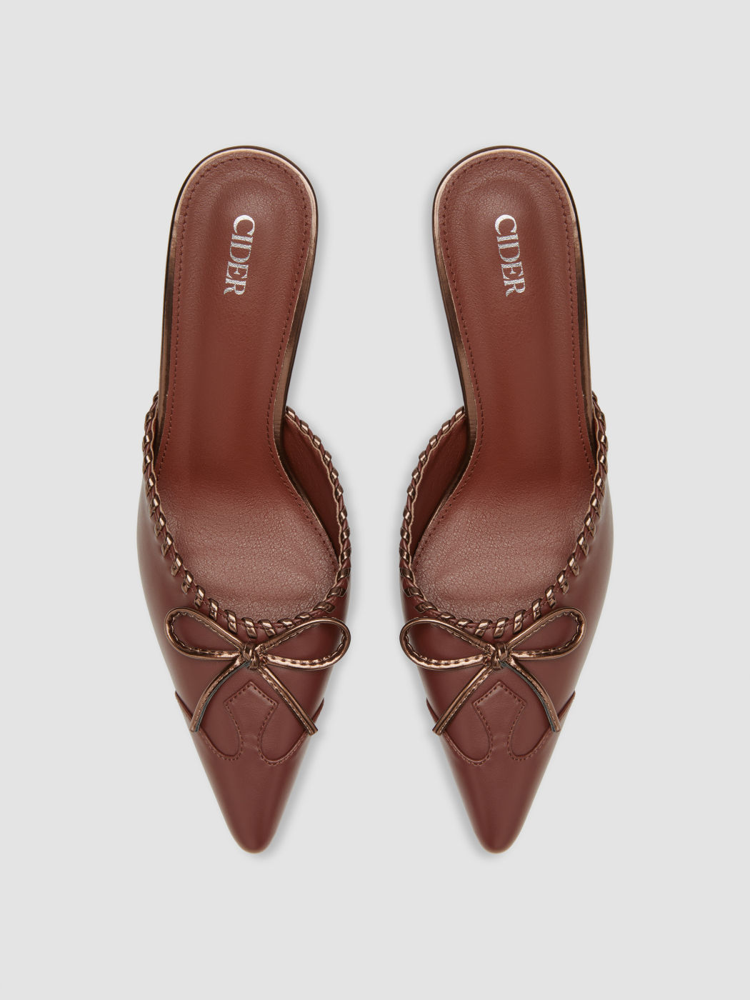 Mules con decorazione intrecciata a fiocco