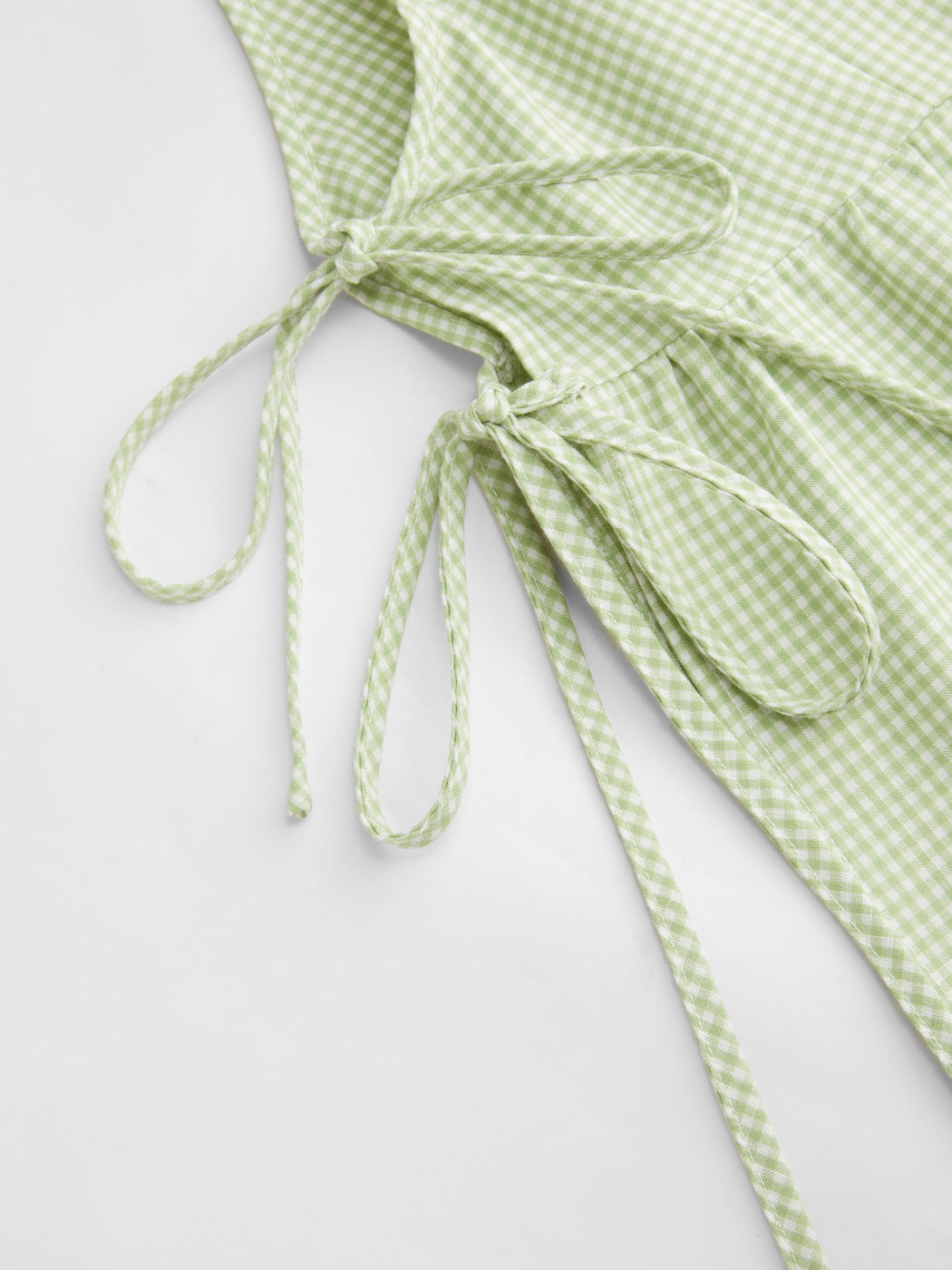 Canotta a quadri con scollo quadrato e fiocco laterale