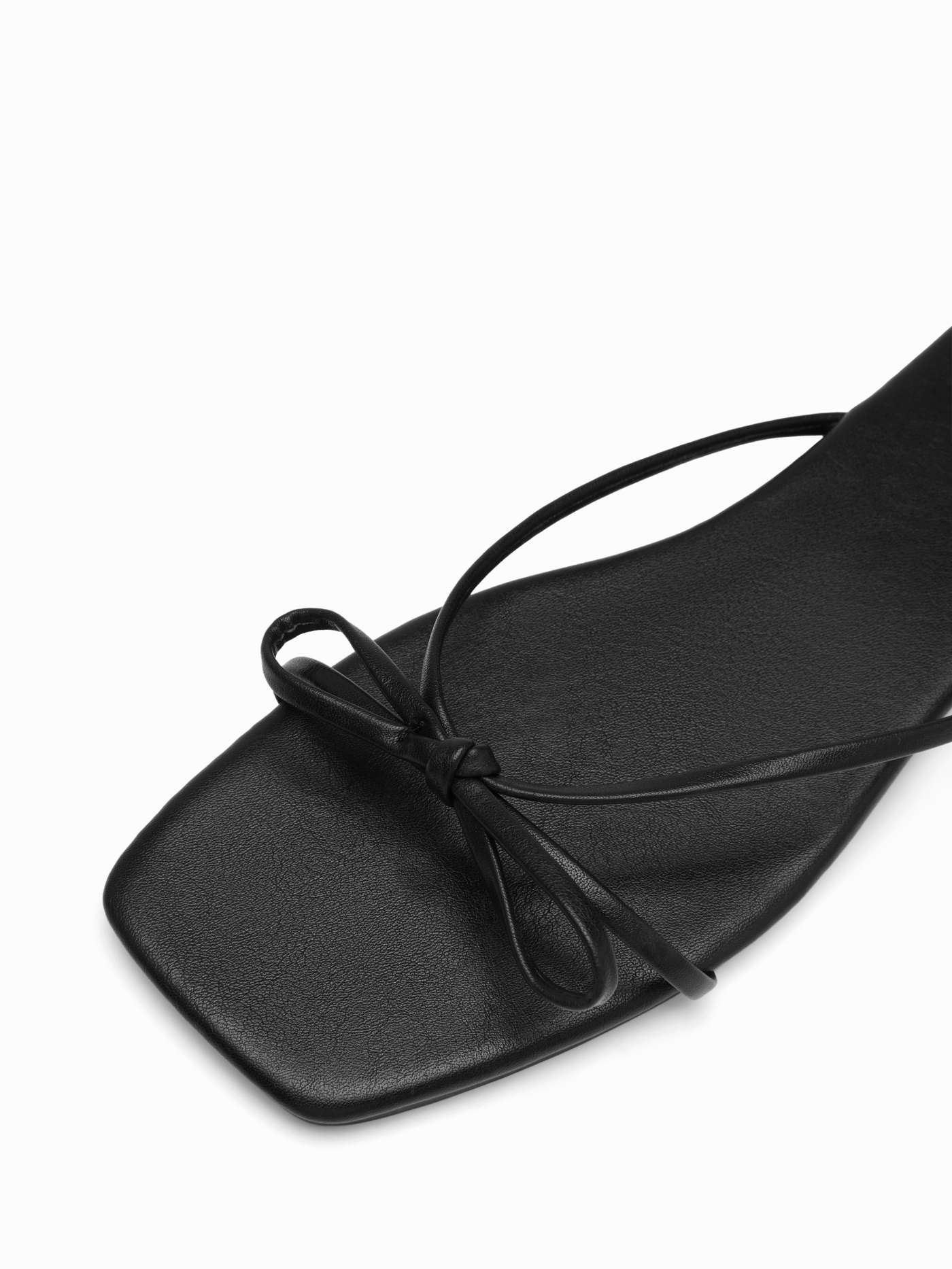BOWKNOT FAUX LEATHER SLIPPERS