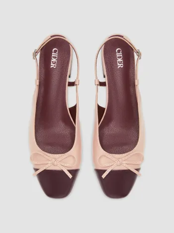 Zweifarbene Mary-Jane-Pumps mit Schleife und Haltestreifen
