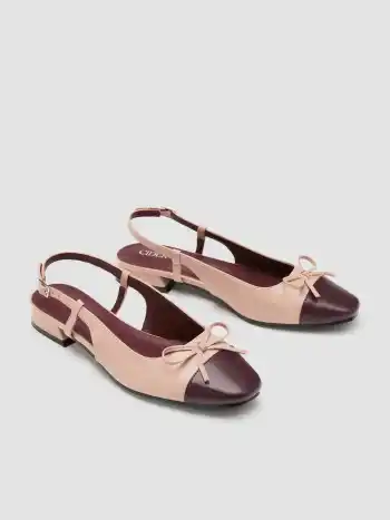 Zweifarbene Mary-Jane-Pumps mit Schleife und Haltestreifen