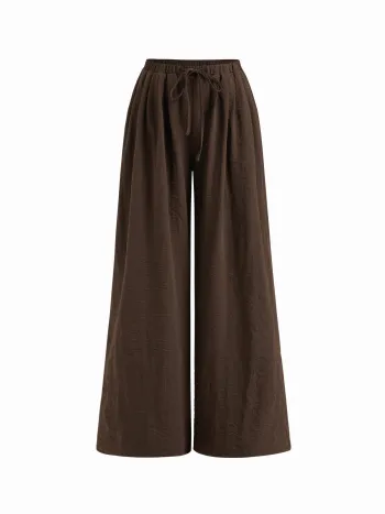 Tief sitzende Hose mit elastischem Bund und Knoten an weiten Beinen