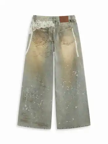 Jeans in denim a vita bassa con pizzo e grafica a gamba larga